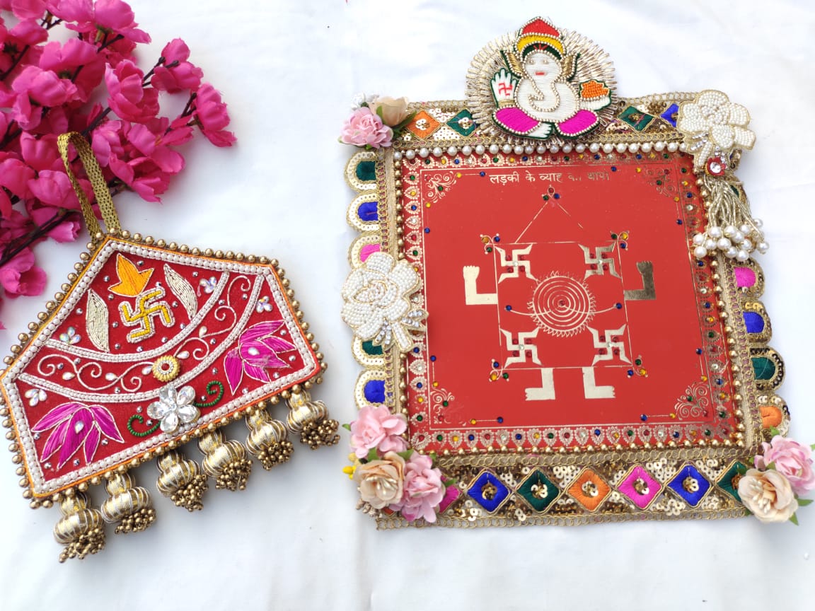 Traditional Indian Wedding Thapa (hanging) and Door Toran Set, decorated with colorful embroidery, sequins, and traditional symbols for a wedding or pooja celebration.