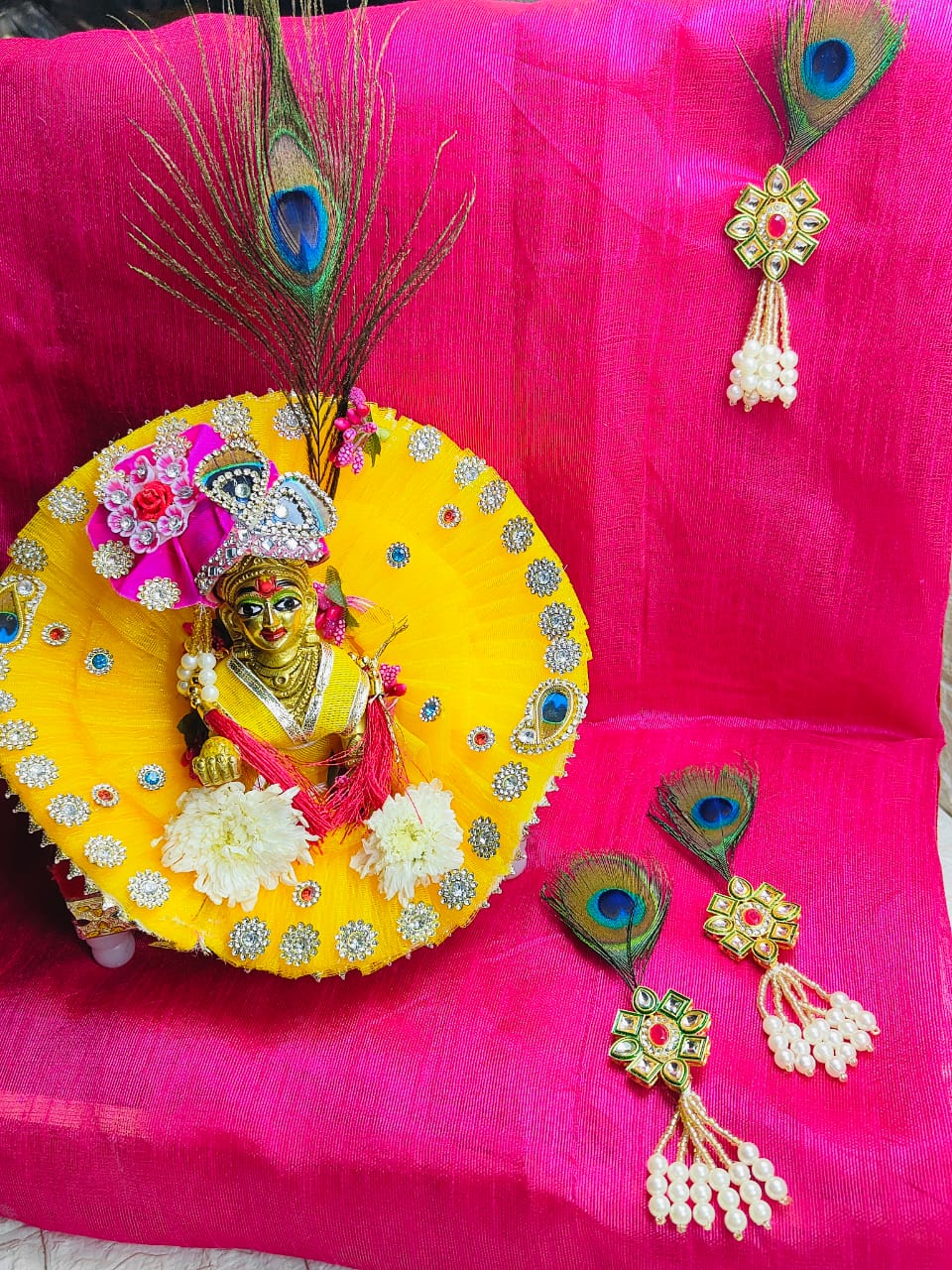 Kundan Brooch with Moti Latkan, featuring a peacock feather, kundan detailing and pearl drops.