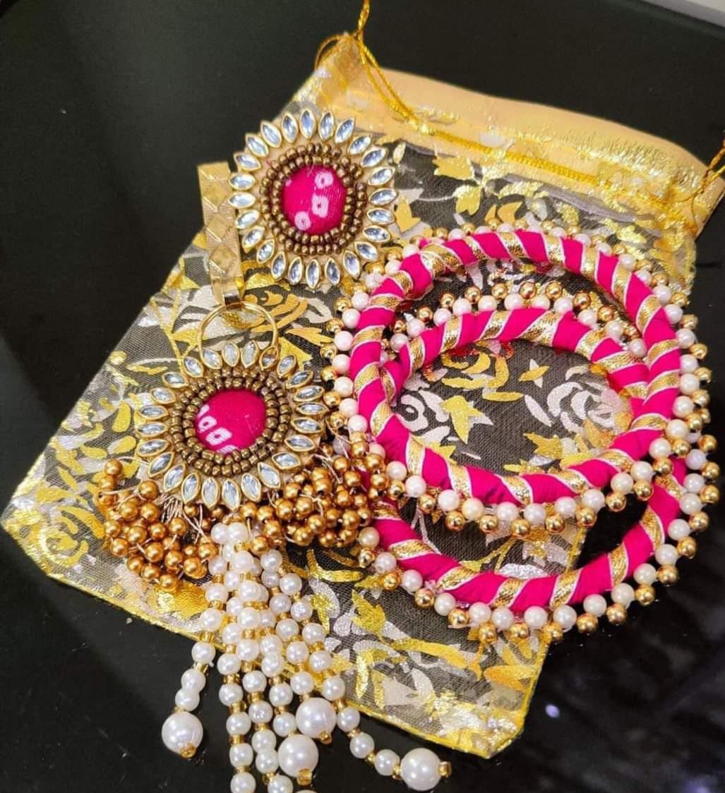 Matching pink and gold earrings with pearl drops, part of a women's festive jewelry giveaway combo, ideal for adding a stylish touch to any outfit.